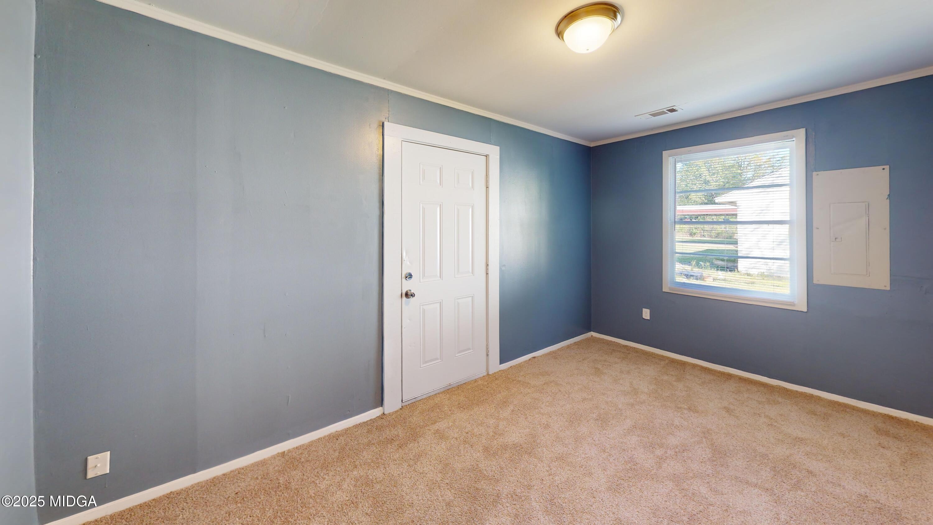3979 Spencer Circle Macon, GA 31206 - Photo 4 of 14 a view of an empty room with window and closet area