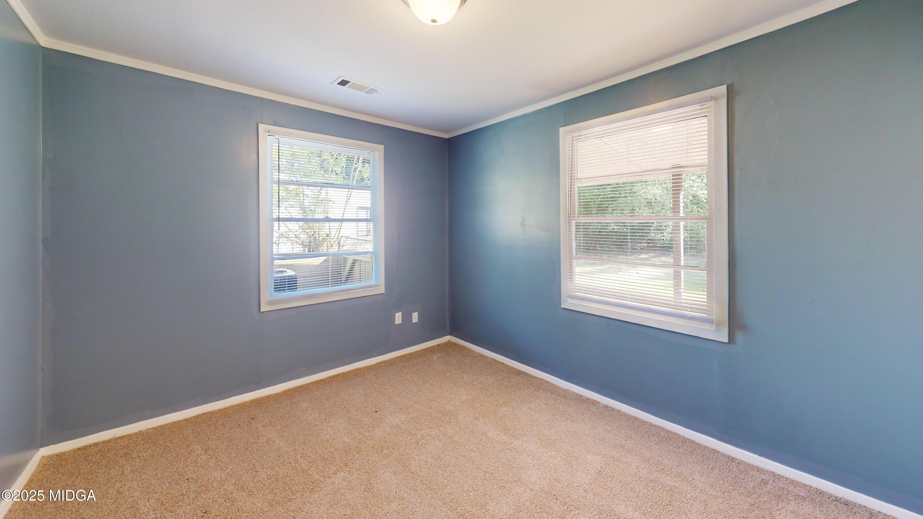 3979 Spencer Circle Macon, GA 31206 - Photo 5 of 14 an empty room with windows