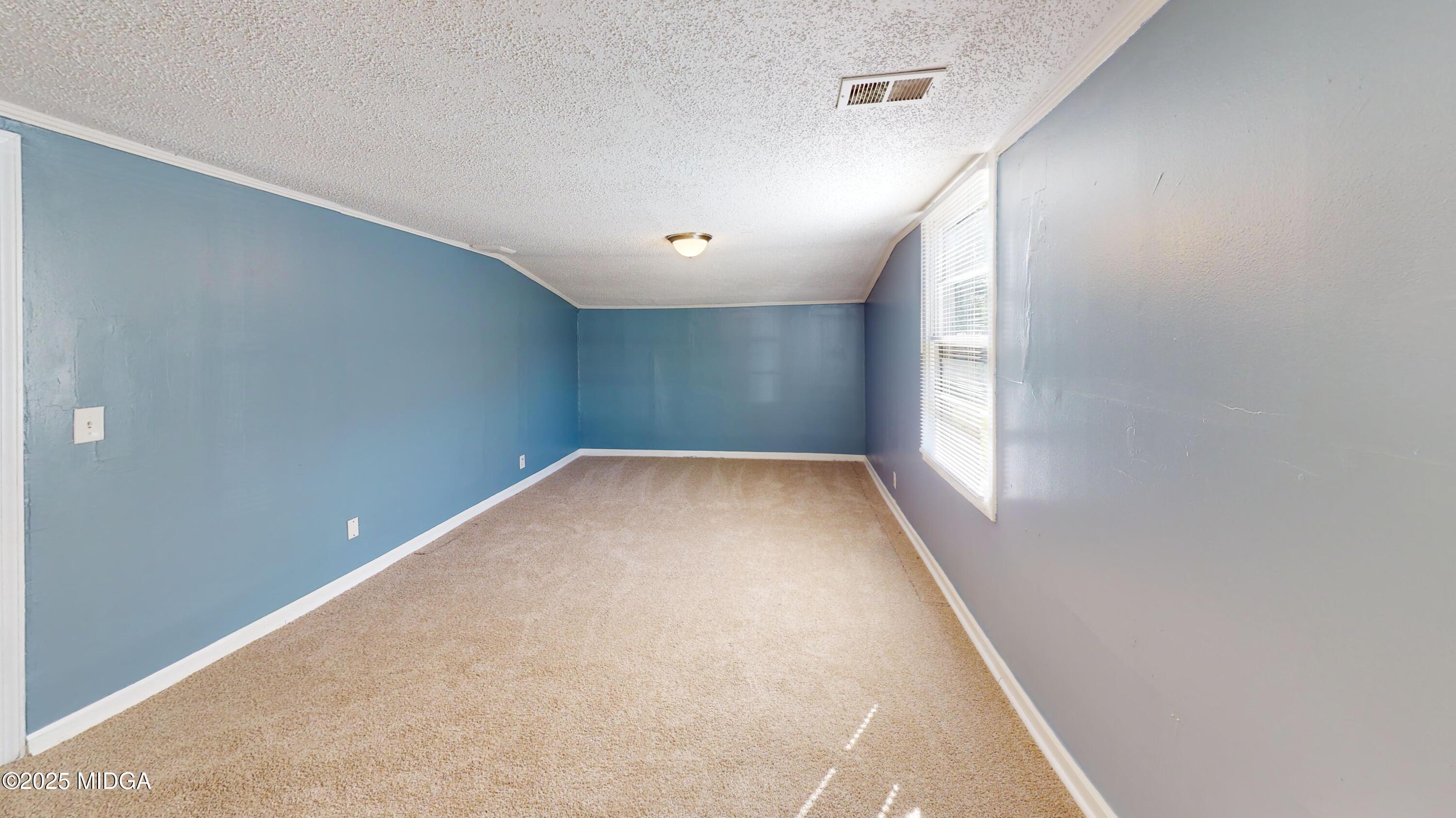 3979 Spencer Circle Macon, GA 31206 - Photo 8 of 14 an empty room with windows