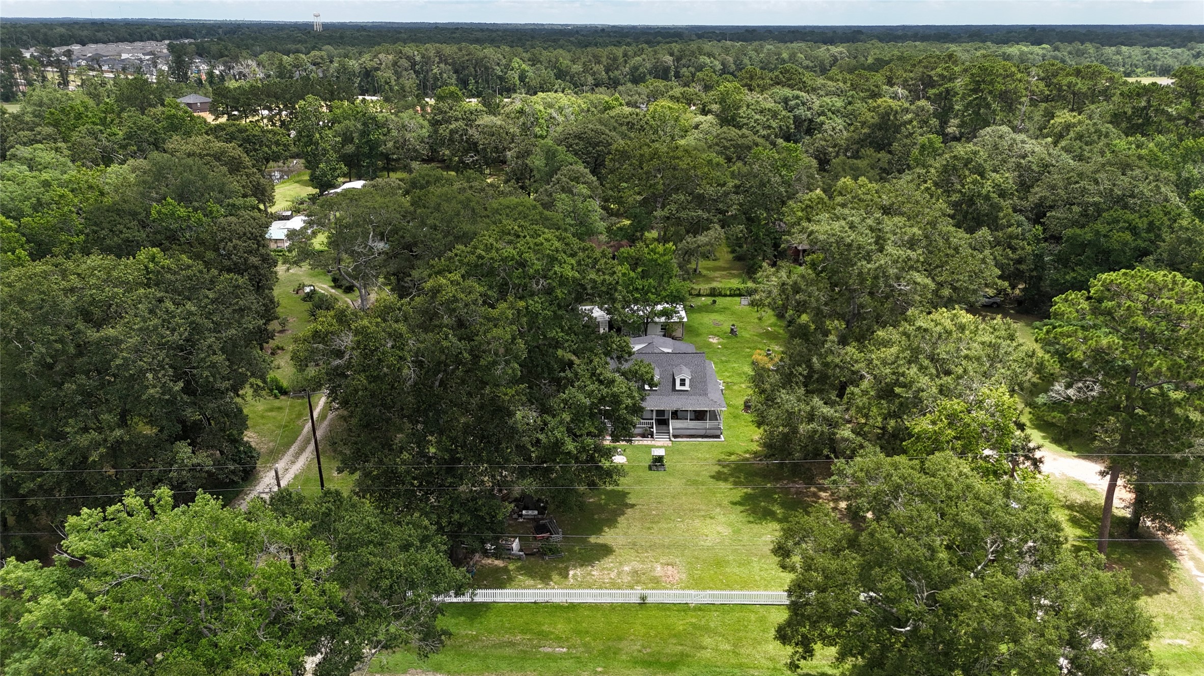 2118 Rolling Hills Road Conroe, TX 77303 - Photo 39 of 39 Mature trees create a private and peaceful backdrop throughout the property.