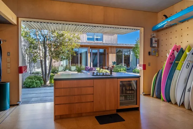a living room with a large window and a table