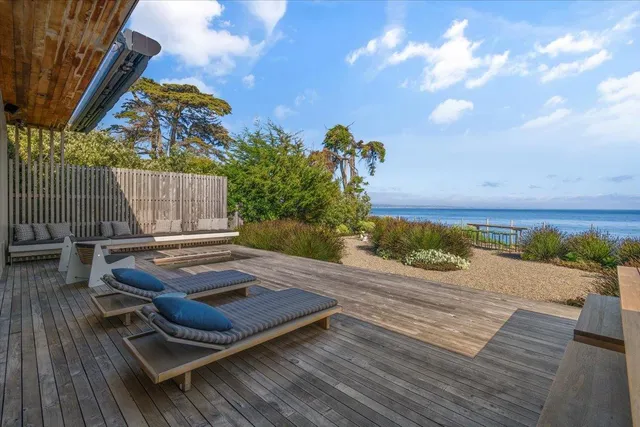 a view of a backyard with sitting area
