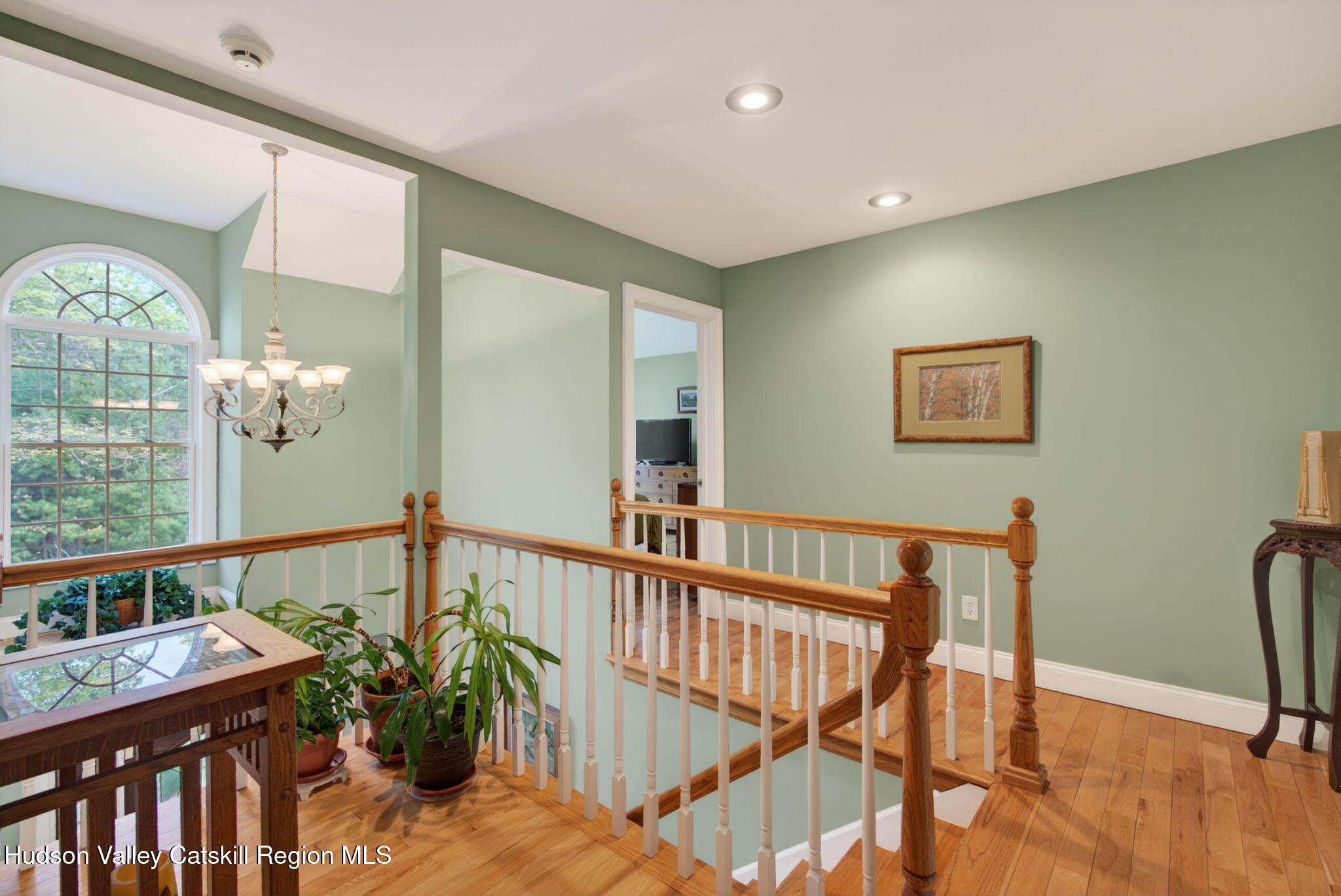 189 Bush Road Stone Ridge, NY 12484 - Photo 20 of 60 a view of a hallway with wooden floor and windows