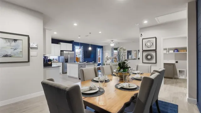 a kitchen with white cabinets and counter space