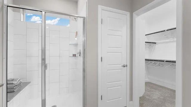 a bathroom with double sink and a mirror