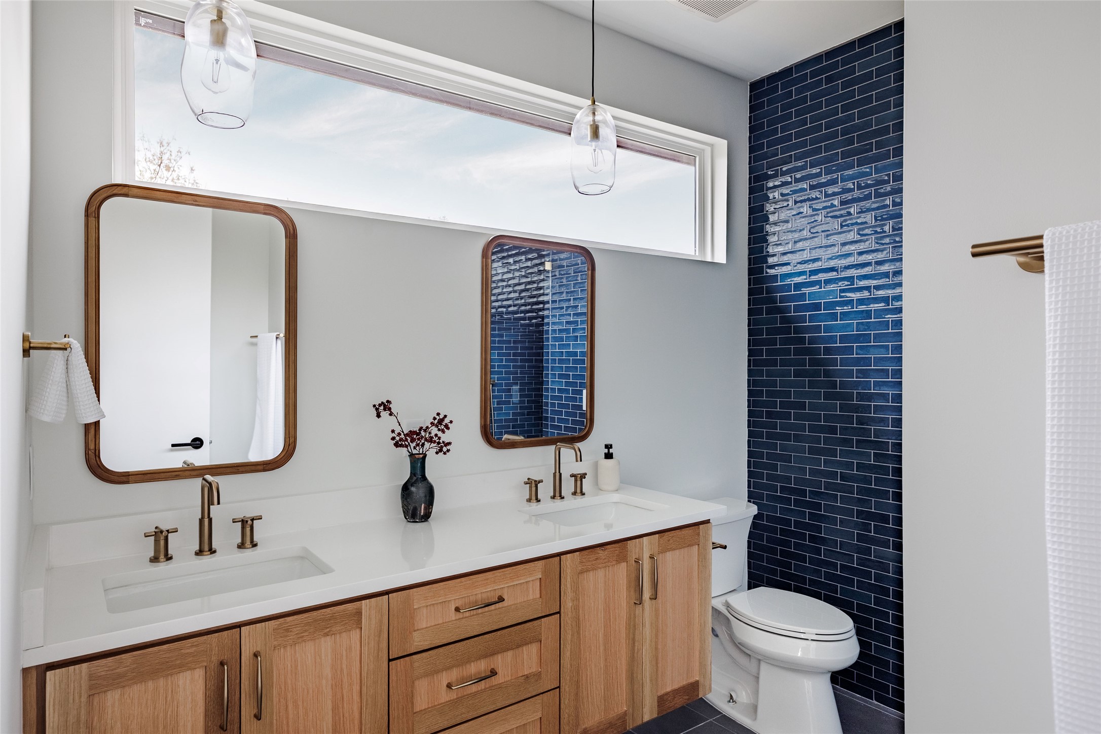 1180 Ridgeway Drive, Unit 2 Austin, TX 78702 - Photo 25 of 40 Full bathroom with double vanity and dark tile patterned flooring
