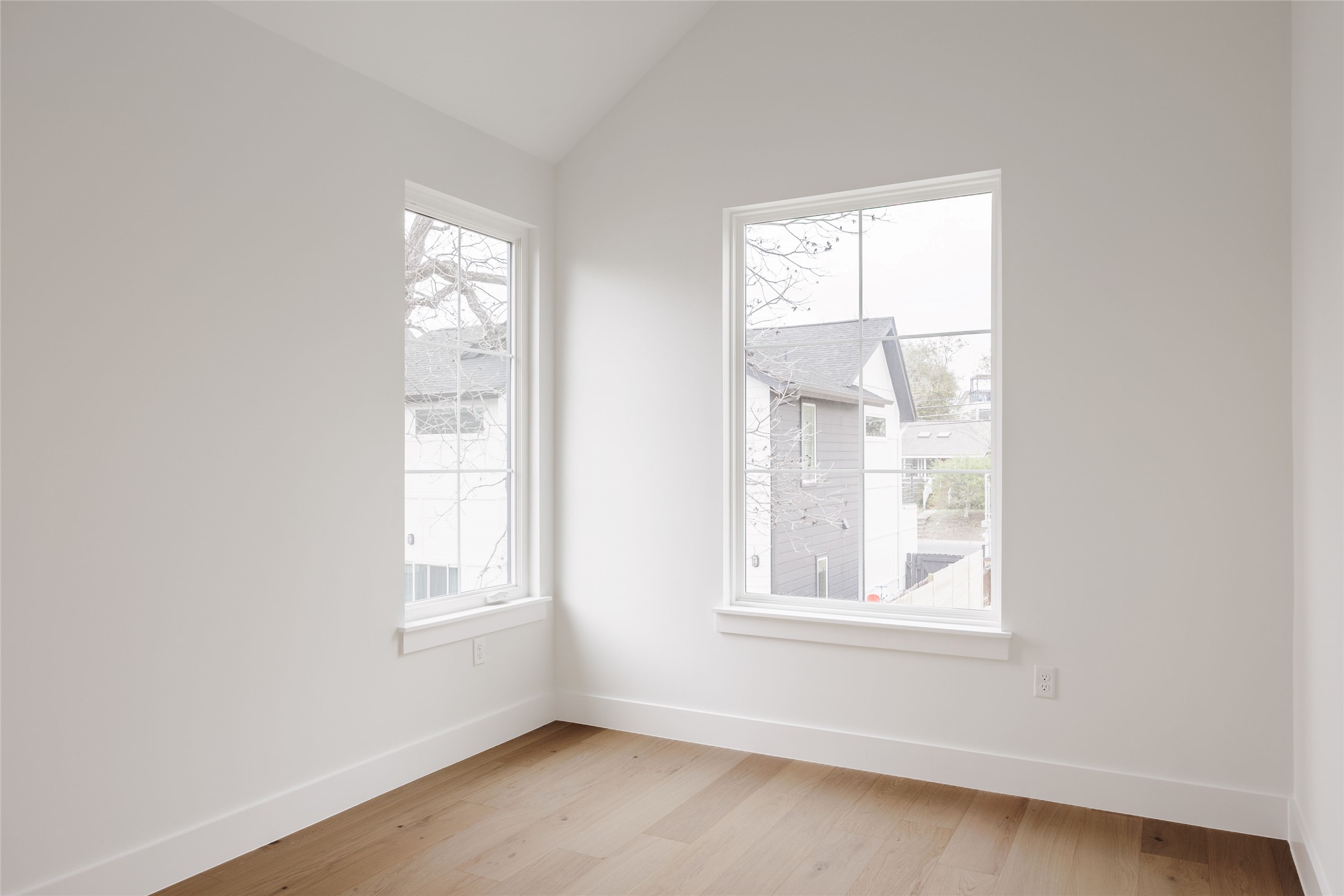 1180 Ridgeway Drive, Unit 2 Austin, TX 78702 - Photo 30 of 40 Spare room featuring light wood-style floors and lofted ceiling