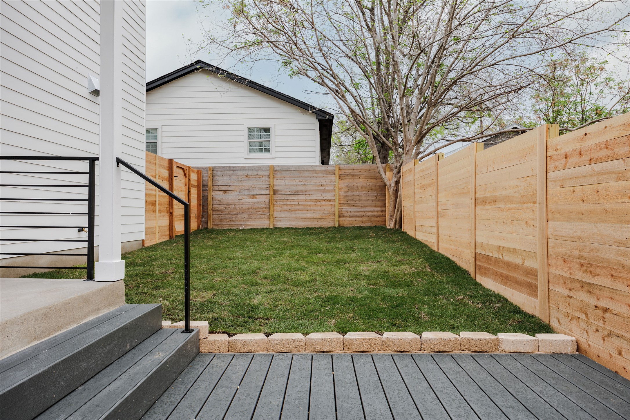 1180 Ridgeway Drive, Unit 2 Austin, TX 78702 - Photo 37 of 40 Fenced backyard featuring a wooden deck
