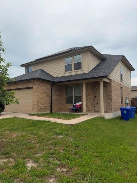 5412 Tama Drive Waco, TX 76708 - Photo 2 of 24 a front view of a house with a yard and garage