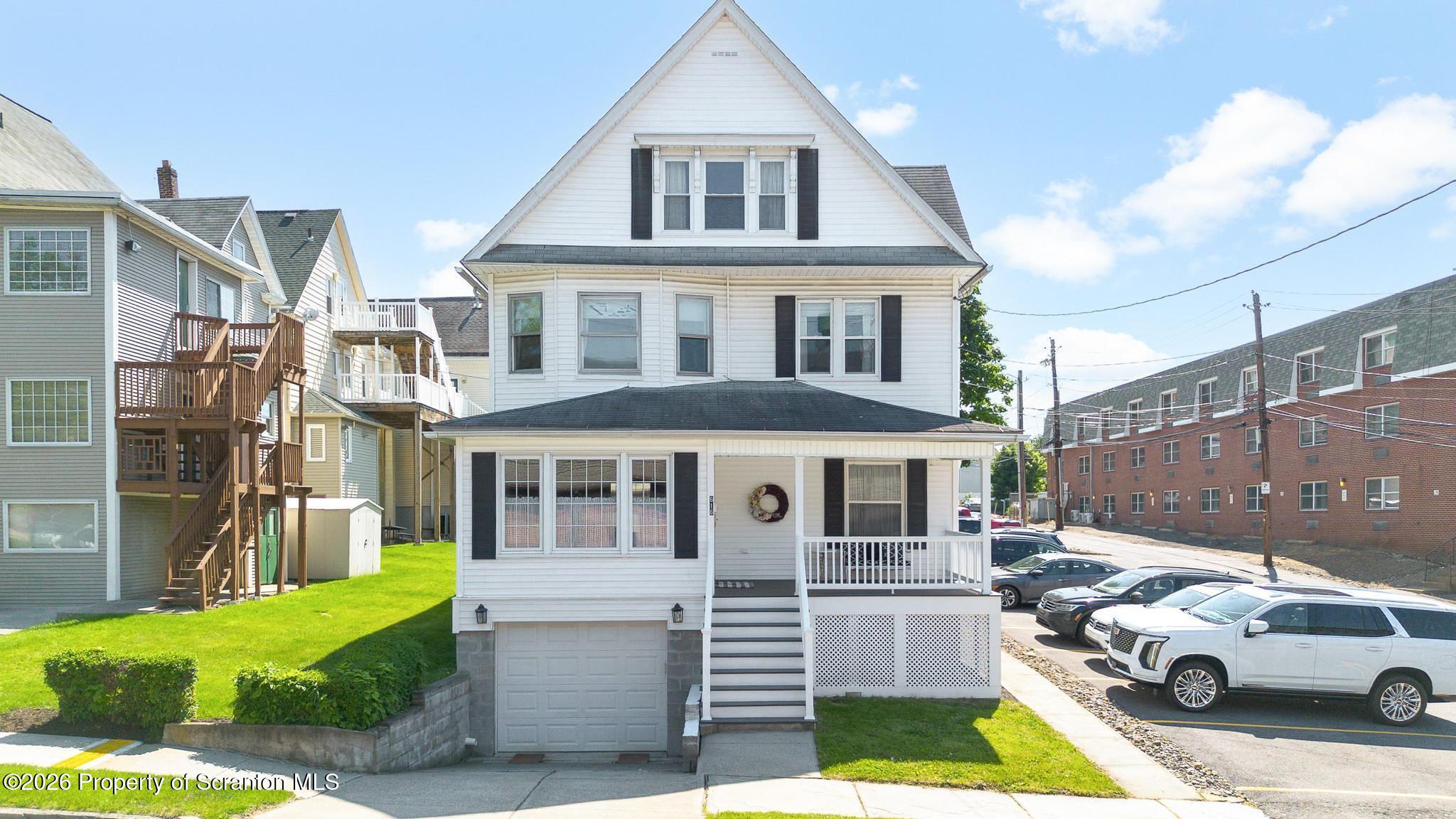 616 Myrtle Street Scranton, PA 18510 - Photo 2 of 65 a front view of a house with a yard