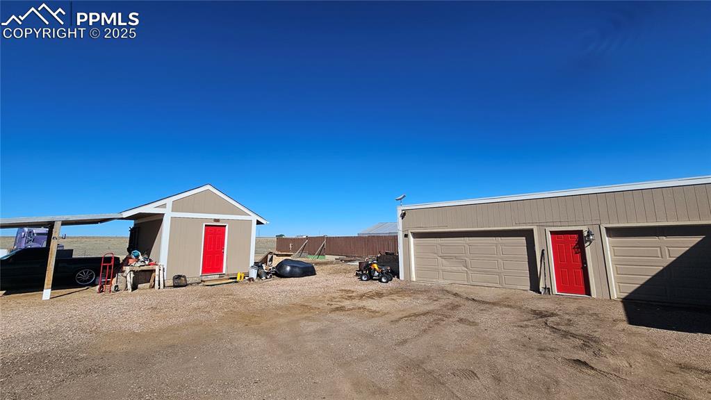 3835 Sengbeil Road Yoder, CO 80864 - Photo 4 of 48 Garage featuring fence