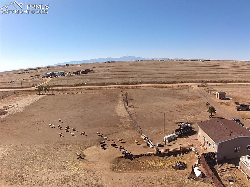 3835 Sengbeil Road Yoder, CO 80864 - Photo 48 of 48 Drone / aerial view featuring a rural view and a mountain view