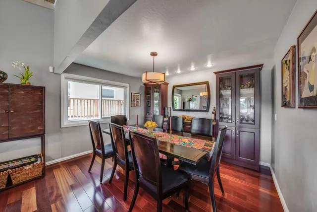 a dining room with furniture and window