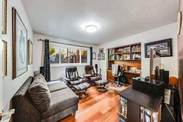a kitchen with a refrigerator and a stove top oven