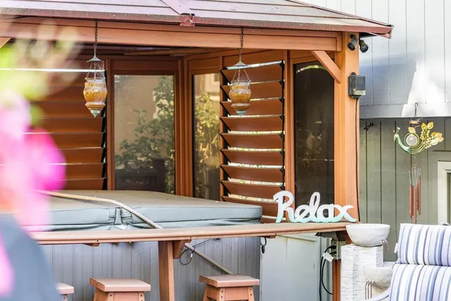 a view of a garden with a building in the background