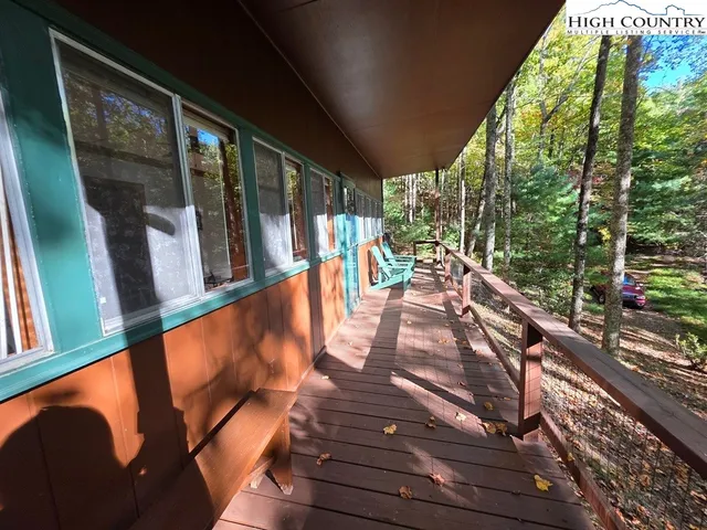 a view of a balcony with wooden floor