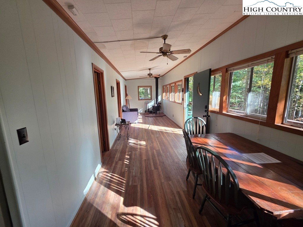 4091 Big Ivy Road Purlear, NC 28665 - Photo 17 of 40 a view of a dining room with furniture wooden floor and chandelier