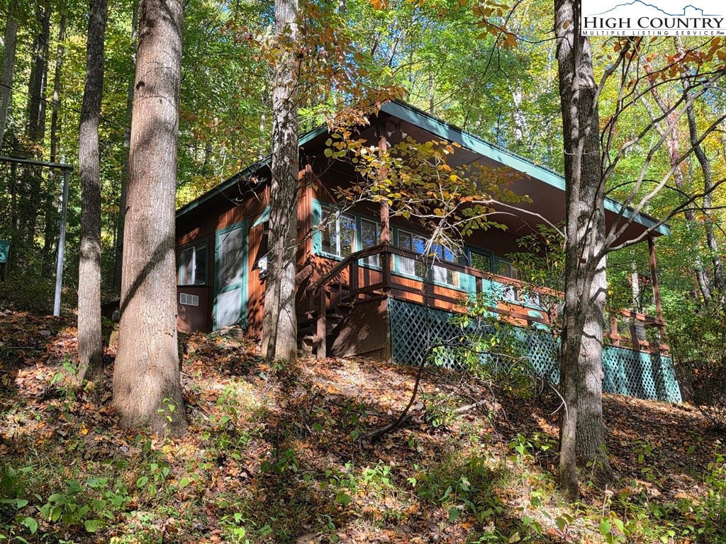 4091 Big Ivy Road Purlear, NC 28665 - Photo 2 of 40 a view of outdoor space yard and blue house