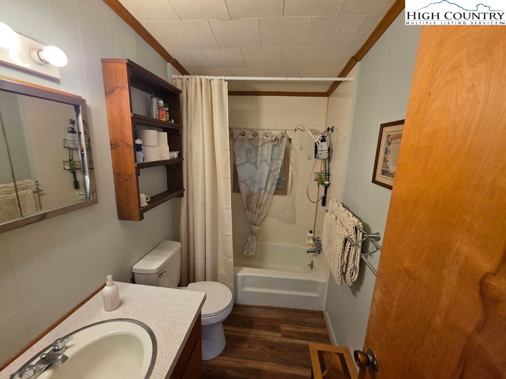 4091 Big Ivy Road Purlear, NC 28665 - Photo 22 of 40 a bathroom with a sink and a mirror
