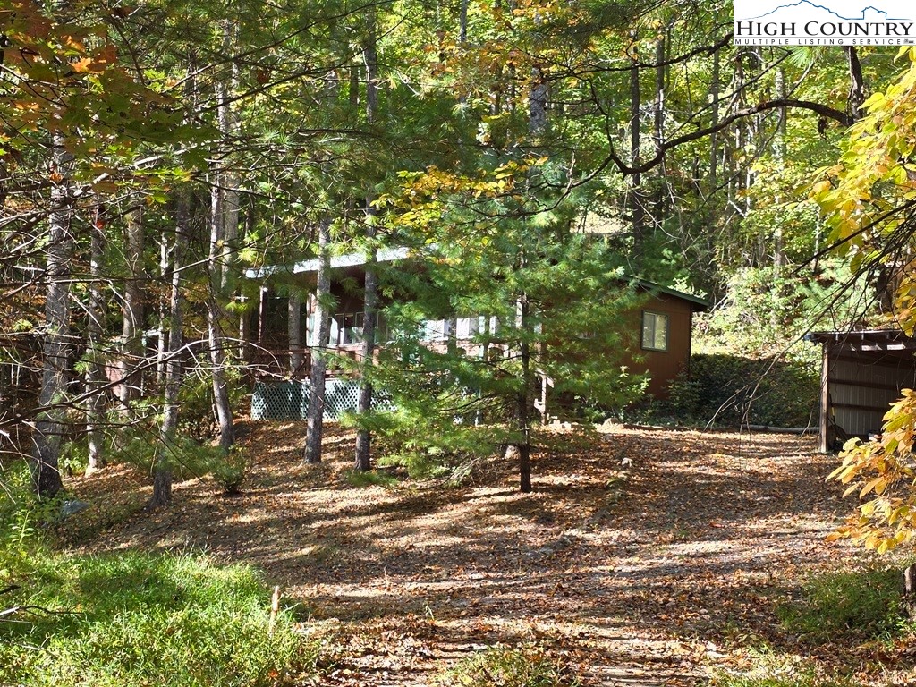 4091 Big Ivy Road Purlear, NC 28665 - Photo 31 of 40 a backyard of a house with lots of green space