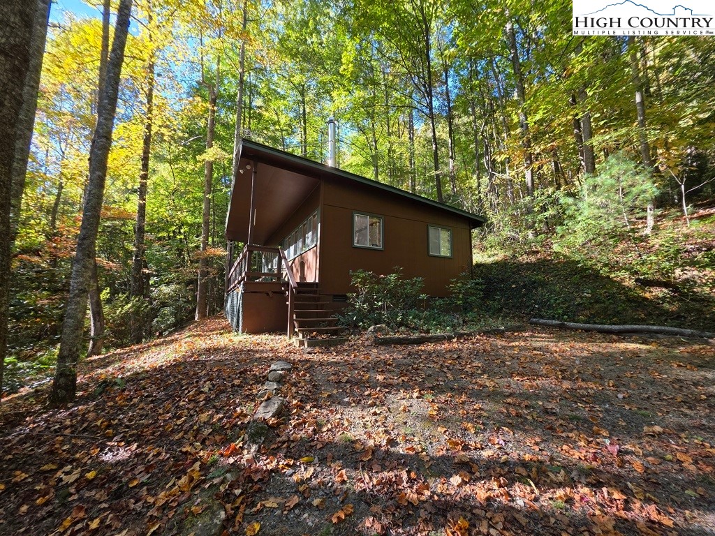 4091 Big Ivy Road Purlear, NC 28665 - Photo 6 of 40 a backyard of a house with lots of green space
