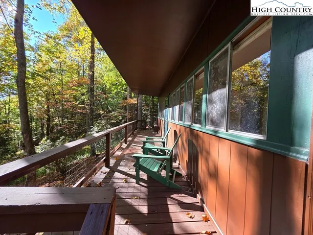 a view of a balcony with chairs