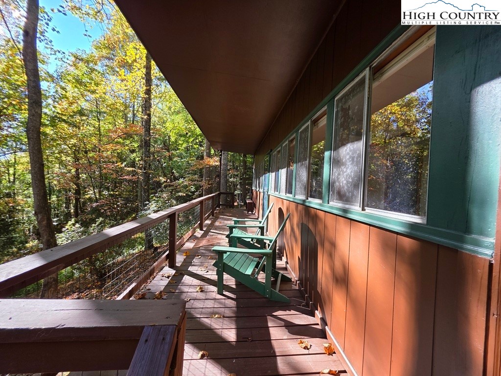 4091 Big Ivy Road Purlear, NC 28665 - Photo 7 of 40 a view of a balcony with chairs