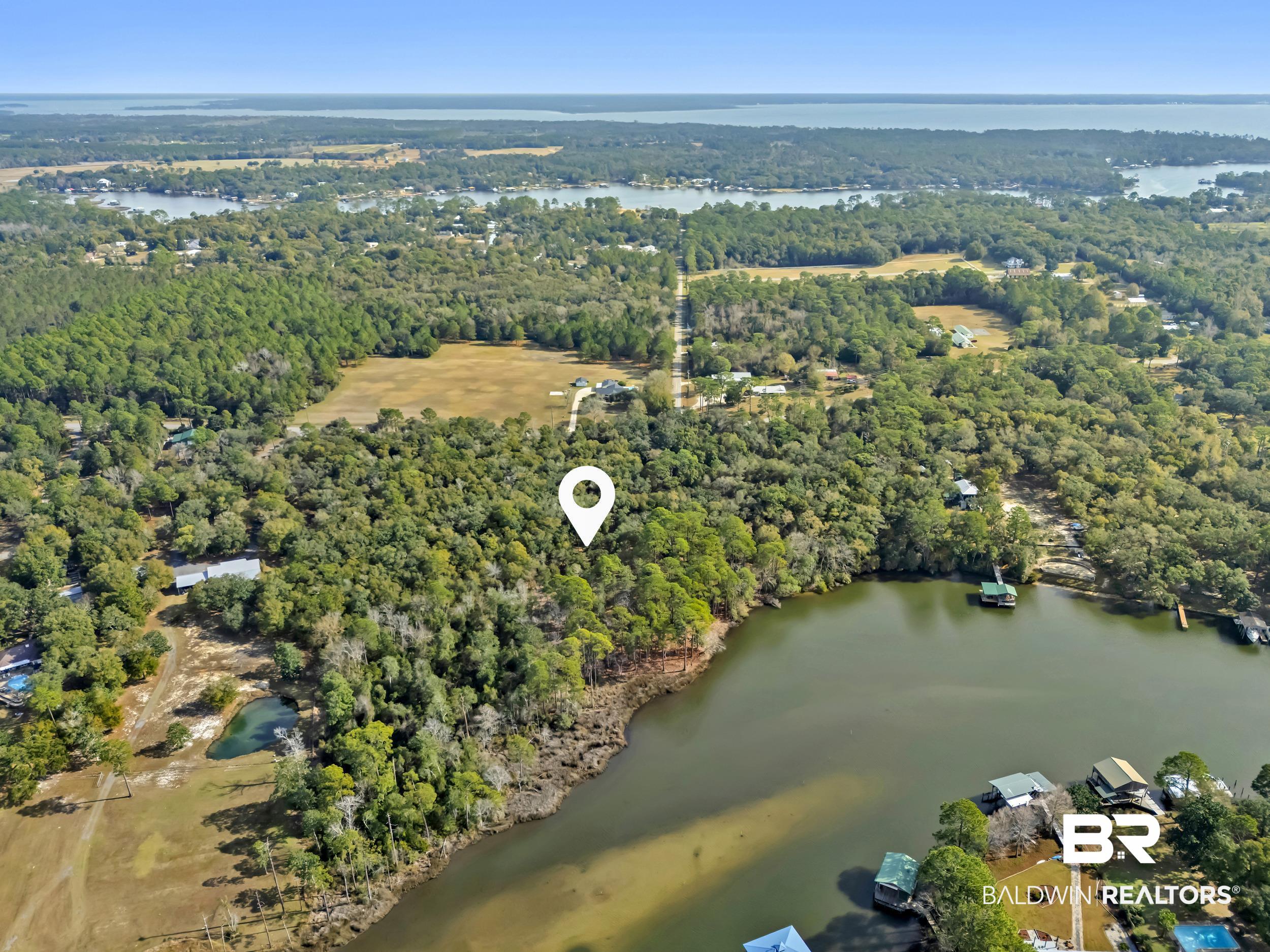 0 County Road 97 Elberta, AL 36530 - Photo 27 of 29 Aerial overview of property's location with a nearby body of water and a forest