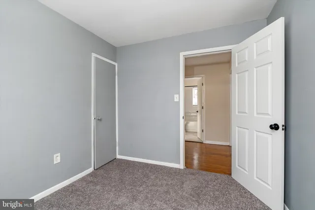 wooden floor and closet area in a room