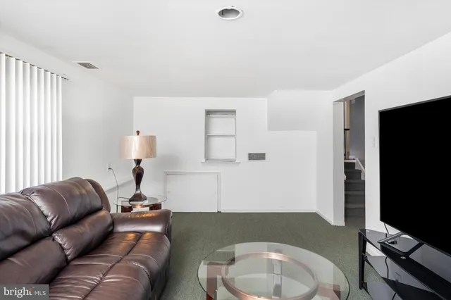 a view of a swimming pool with a table and chairs