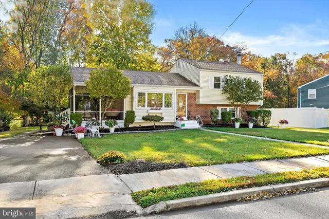 a front view of a house with a garden and patio