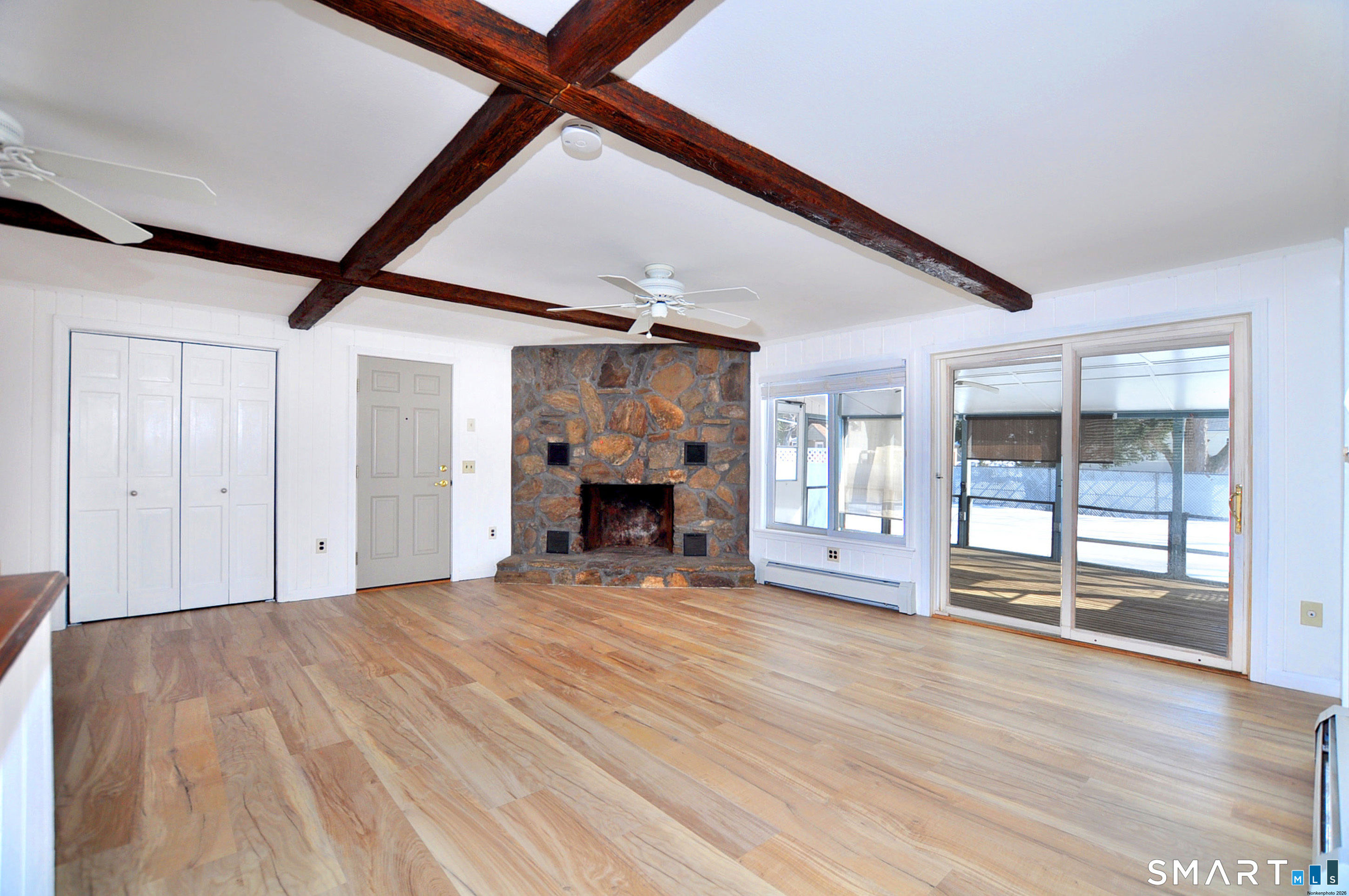 18 Play Road Enfield, CT 06082 - Photo 14 of 40 A wonderful upgrade with luxury vinyl flooring. A gorgeous stone fireplace is the focal point to this large living space.