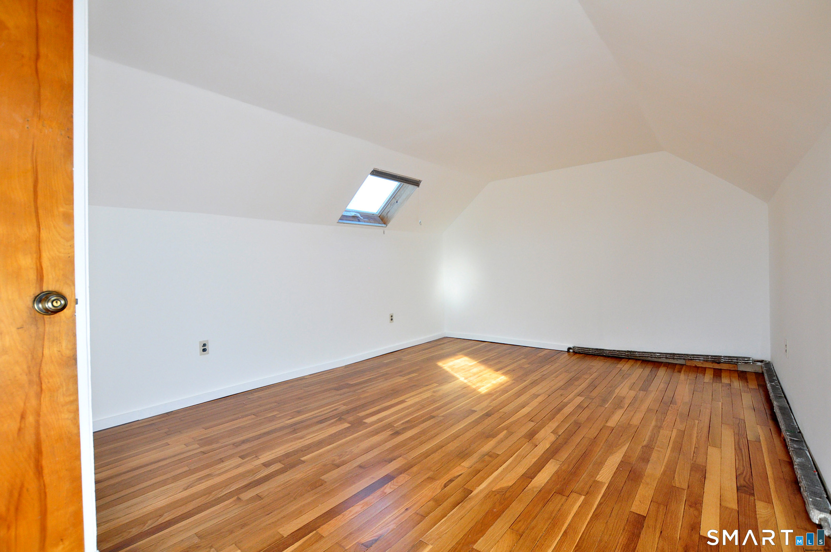 18 Play Road Enfield, CT 06082 - Photo 3 of 40 This upstairs bedroom has been updated with drywall and refinished hardwood flooring. Great sunlight too!