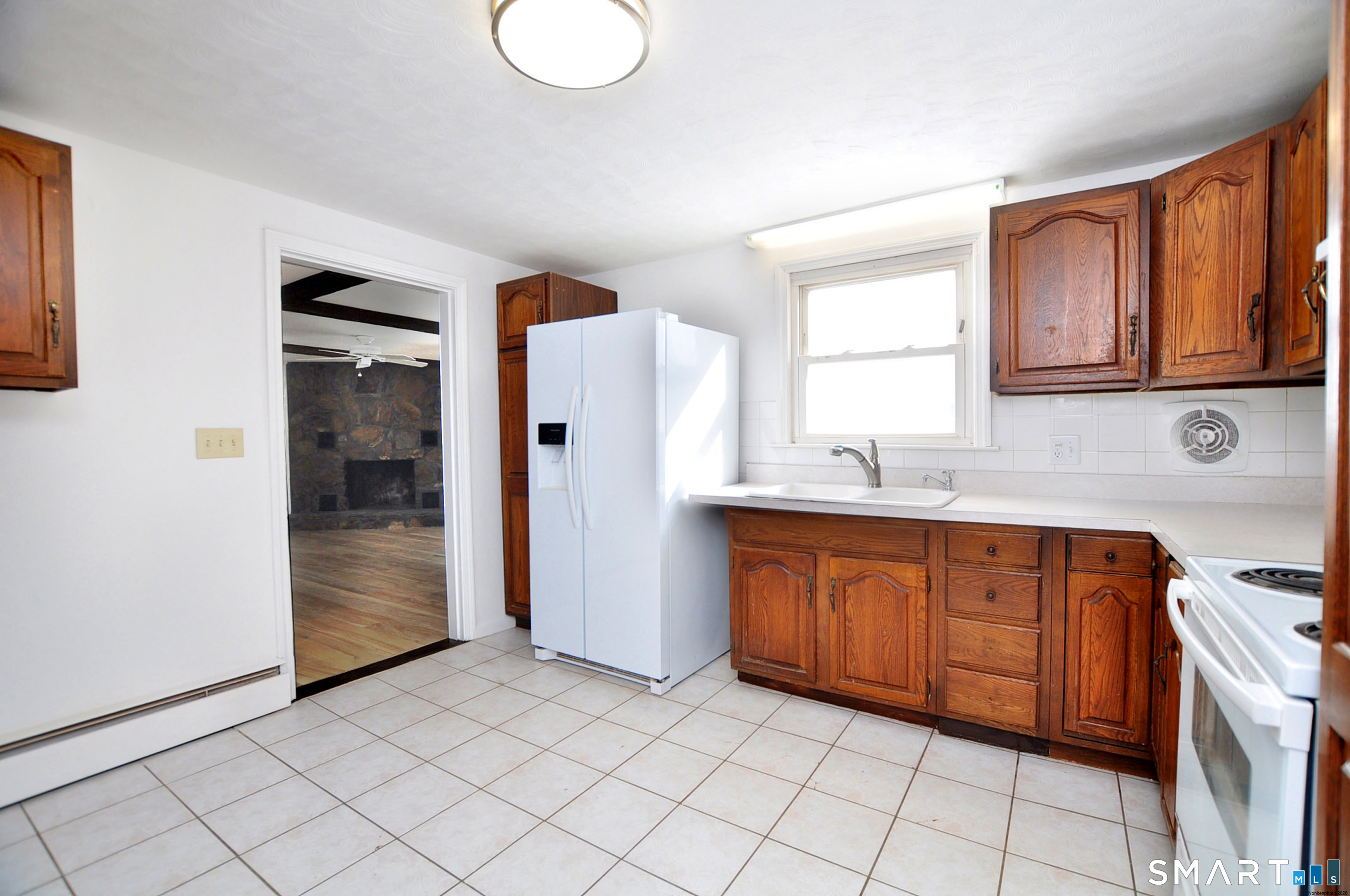 18 Play Road Enfield, CT 06082 - Photo 31 of 40 An eat in kitchen off of the family room. Kitchen sink area overlooks the back yard