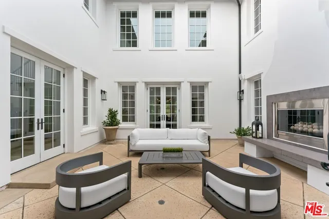 a dining room with furniture a livingroom and chandelier
