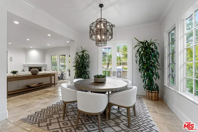 a kitchen with stainless steel appliances kitchen island granite countertop a stove a sink a refrigerator and a refrigerator