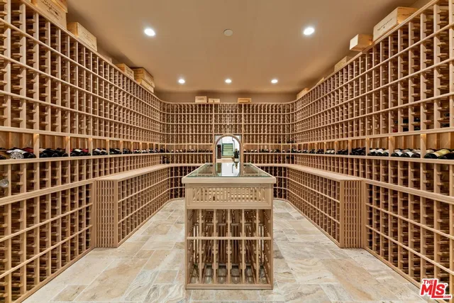 a bathroom with a tub shower sink and mirror