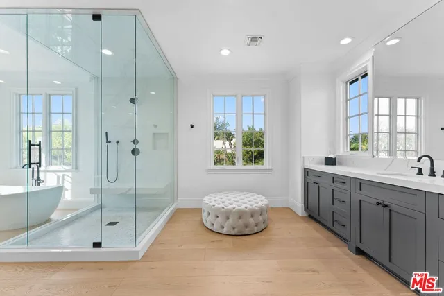 a balcony with furniture and a floor to ceiling window