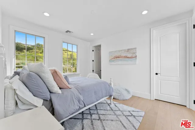 a view of a patio with table and chairs and potted plants