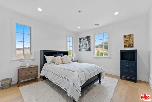 a view of a patio with table and chairs and potted plants