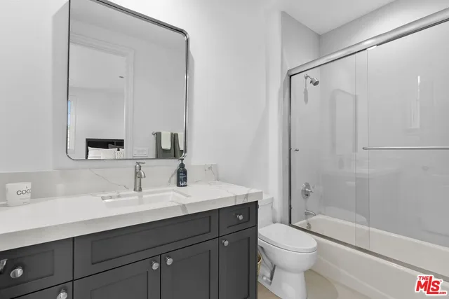 a view of backyard of house with seating space