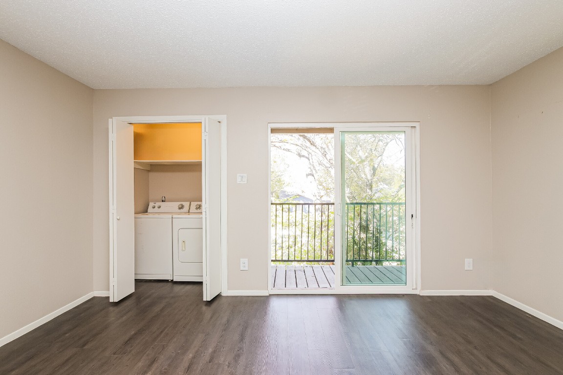 5201 Evans Avenue, Unit A Austin, TX 78751 - Photo 14 of 16 a view of an empty room with wooden floor and a window