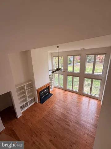 a kitchen with stainless steel appliances granite countertop a sink a refrigerator and a stove top oven