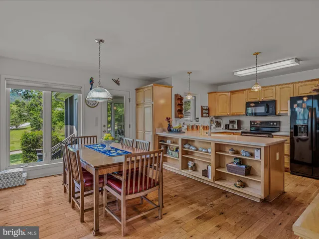 a room with fireplace furniture and a chandelier
