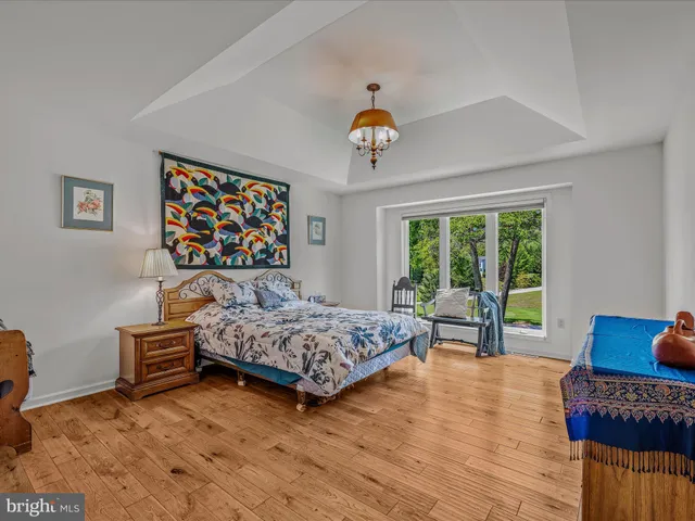 a bedroom with two beds and a lamp