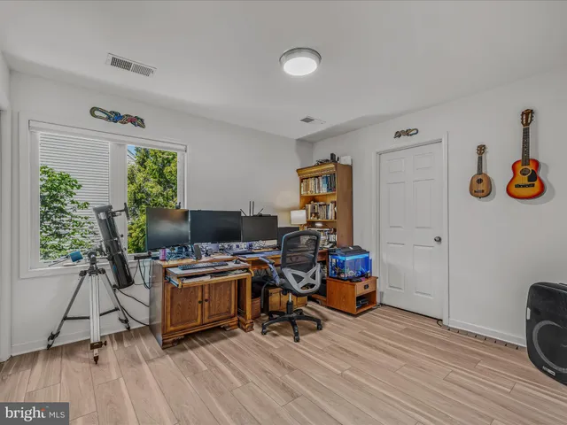 an aerial view of residential house with outdoor space and swimming pool