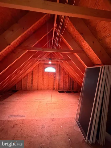 an aerial view of a house with a yard and lake view