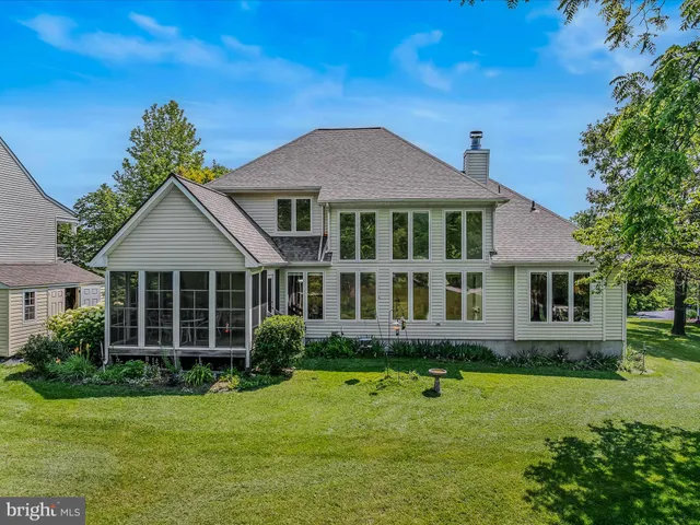 a view of a swimming pool with a yard