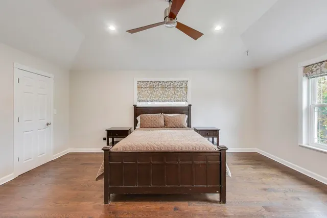 a bedroom with a bed and window