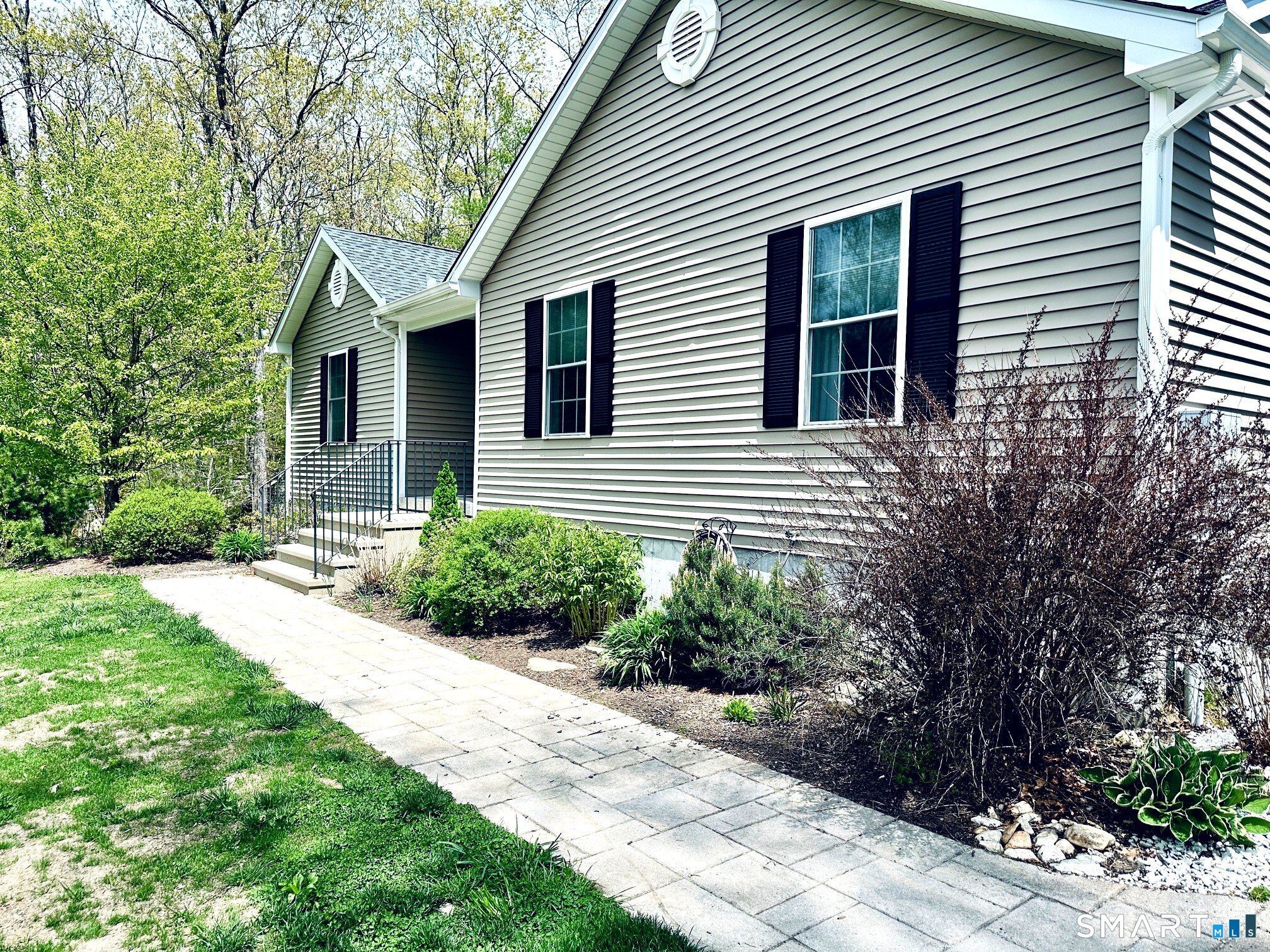 29 Logans Lane Thompson, CT 06277 - Photo 3 of 40 a front view of a house with a yard